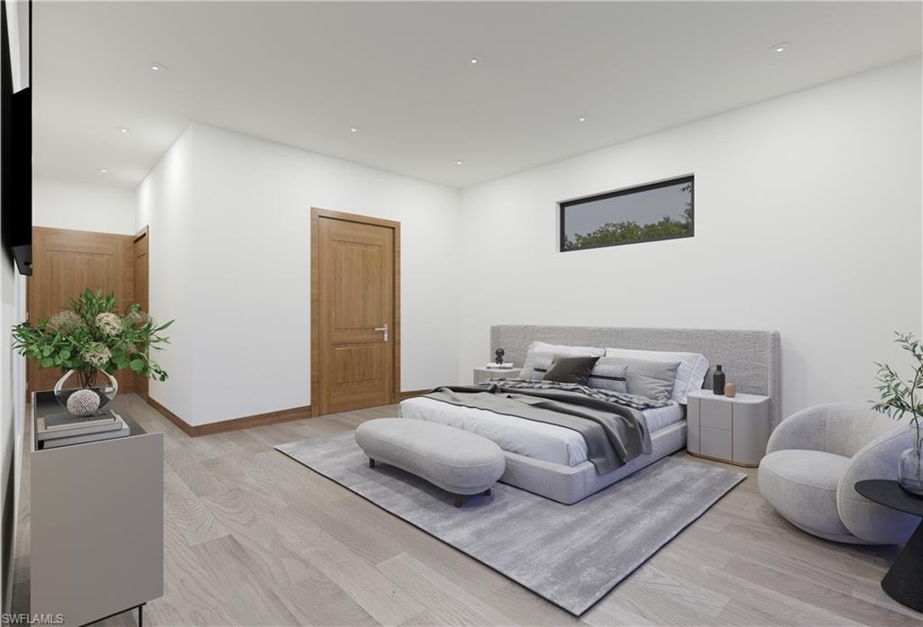 Bedroom with light wood-type flooring and recessed lighting
