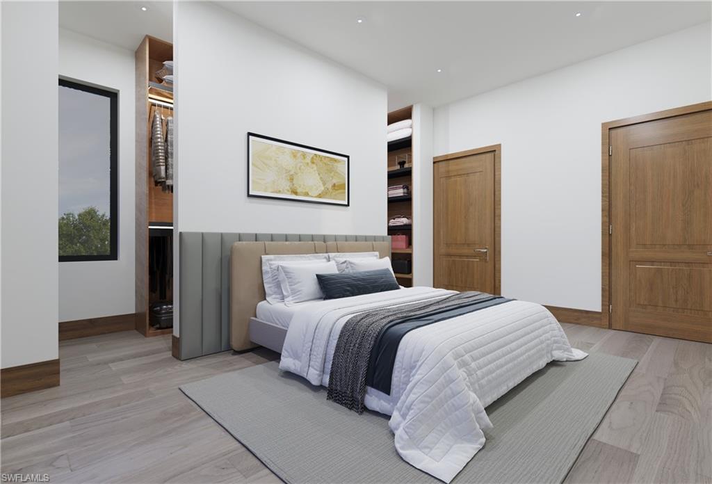 Bedroom featuring light wood finished floors and baseboards