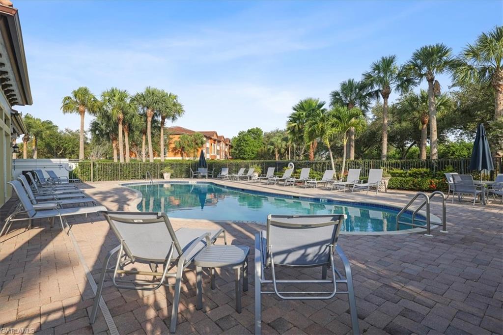 Community pool featuring a patio area