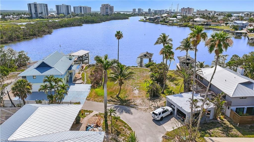 View of urban area featuring a large body of water-  VIRTUALLY ENHANCED