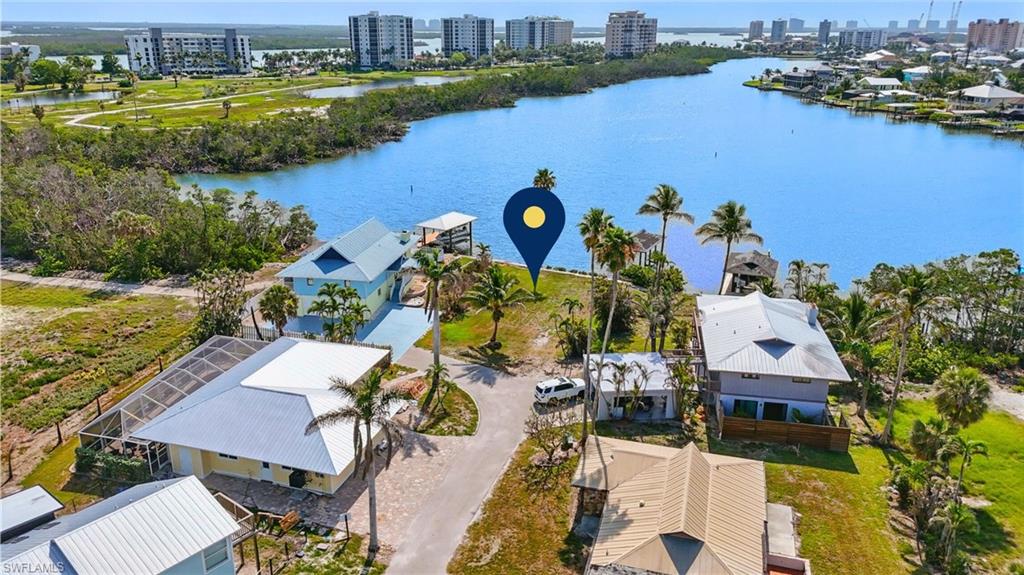View of urban area featuring a large body of water VIRTUALLY ENHANCED