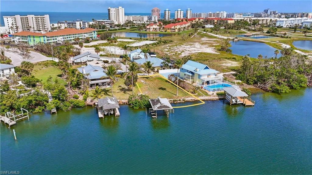 View of urban area featuring a nearby body of water-  VIRTUALLY ENHANCED