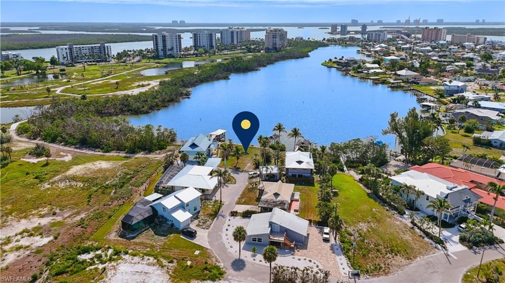 View of urban area featuring a nearby body of water-  VIRTUALLY ENHANCED
