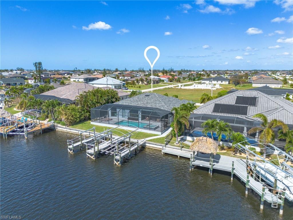 Bird's eye view featuring a water view and docks
