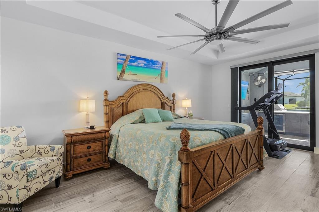 Bedroom with ceiling fan and tile floors