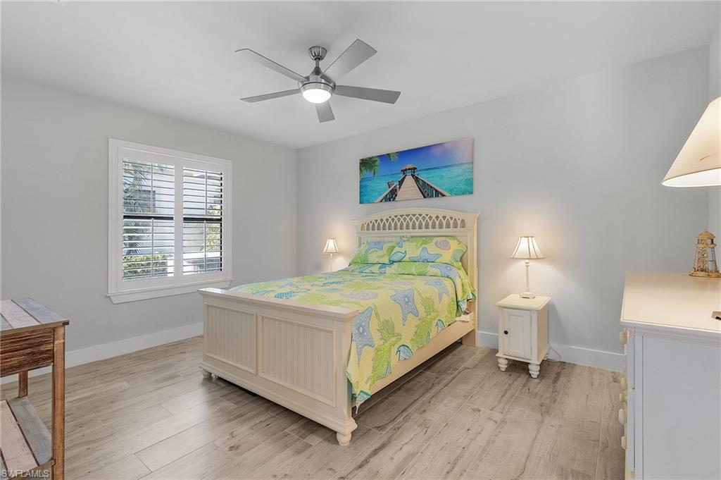Bedroom featuring ceiling fan and tile flooring