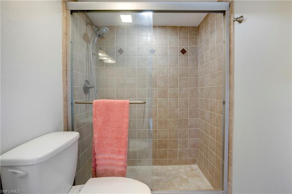 Custom tile and glass shower door.