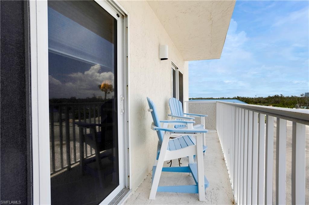 sliders from guest bedroom to open balcony.
