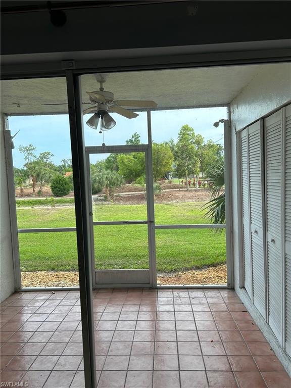 SCREENED LANAI AREA OVERLOOKNG THE NEIGHBORING GOLF COURSE