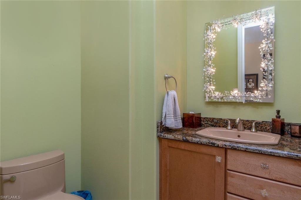 Half bath featuring crystal specialty lighting