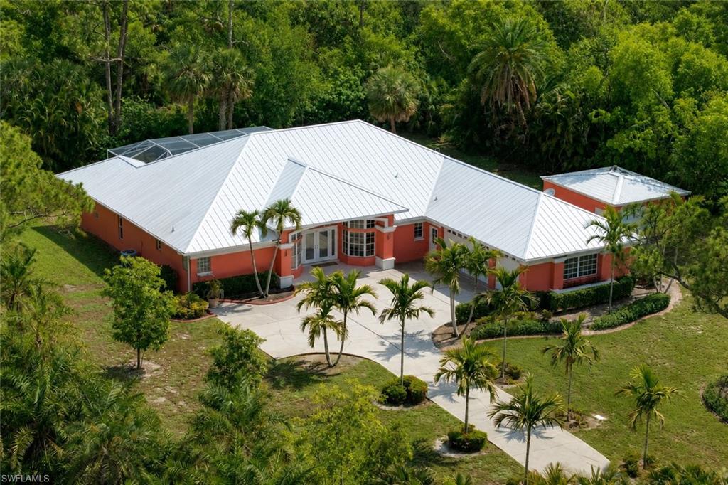 View of building exterior featuring driveway