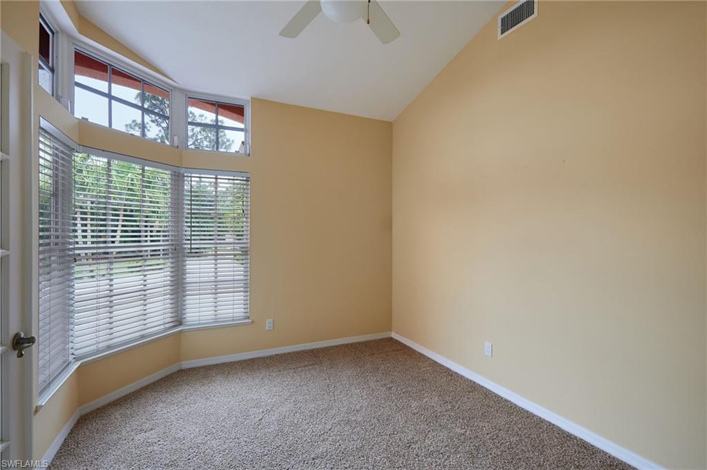 Unfurnished room featuring a ceiling fan and light tile patterned flooring