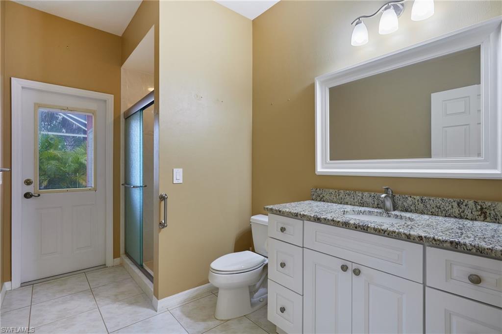 Unfurnished bedroom with carpet flooring, multiple closets, a ceiling fan, and baseboards