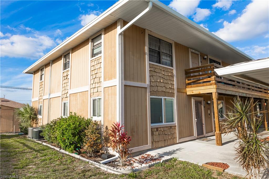 View of home's exterior with cooling unit and a patio