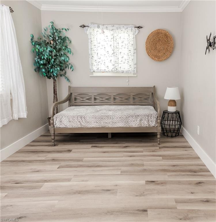 Bedroom with ornamental molding