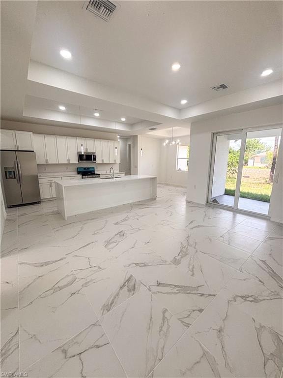 Laundry room featuring light marble finish floors, hookup for a washing machine, and electric dryer hookup