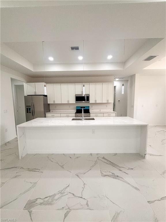 Garage featuring water heater, recessed lighting, electric panel, and a garage door opener