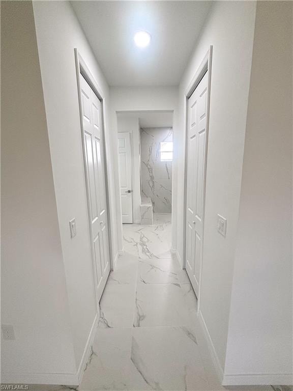 Full bathroom with vanity and a marble finish shower