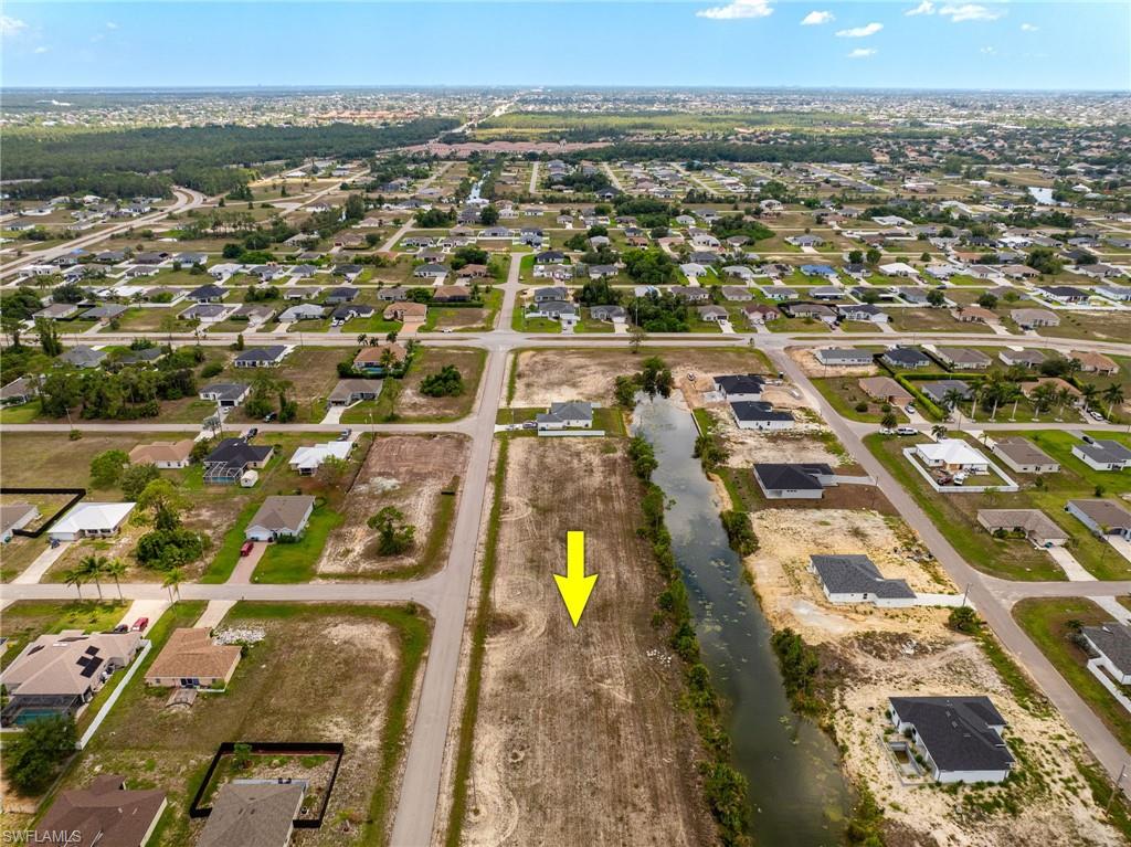 View of property location with nearby suburban area