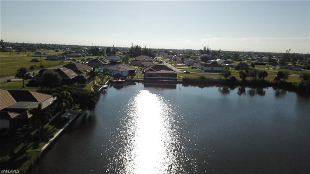 Aerial view of residential area with a nearby body of water