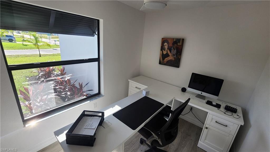Office with wood finished floors