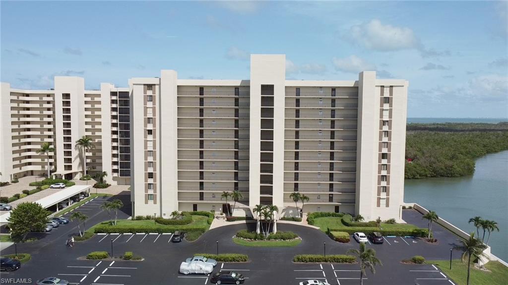 View of apartment building / complex with a water view