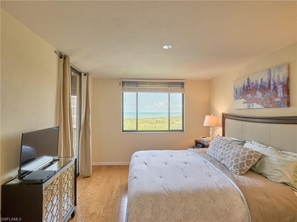 Bedroom with light wood-style floors and baseboards