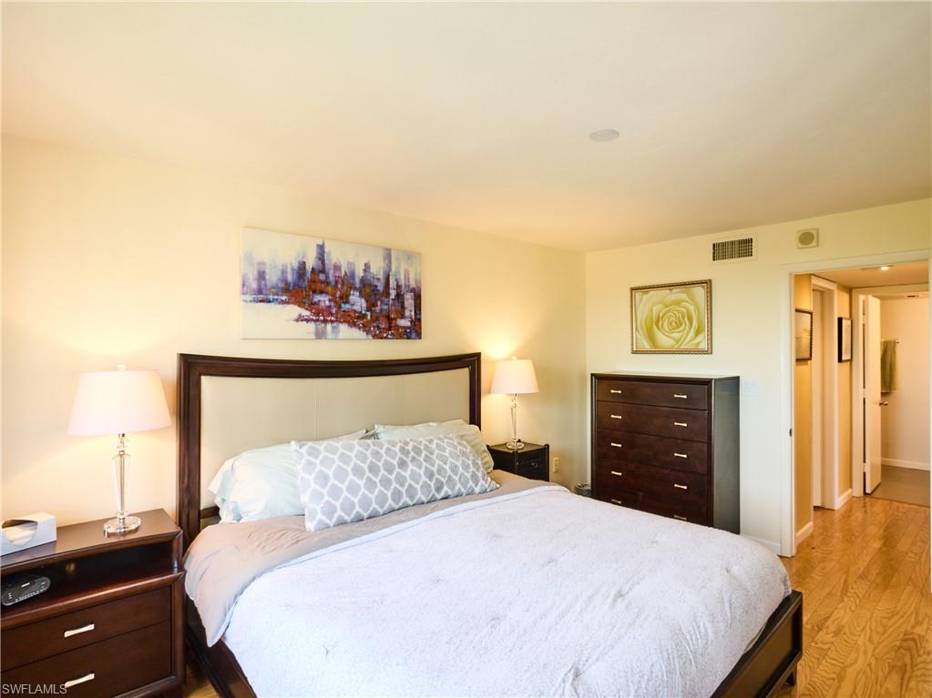 Bedroom with light wood-style floors and baseboards