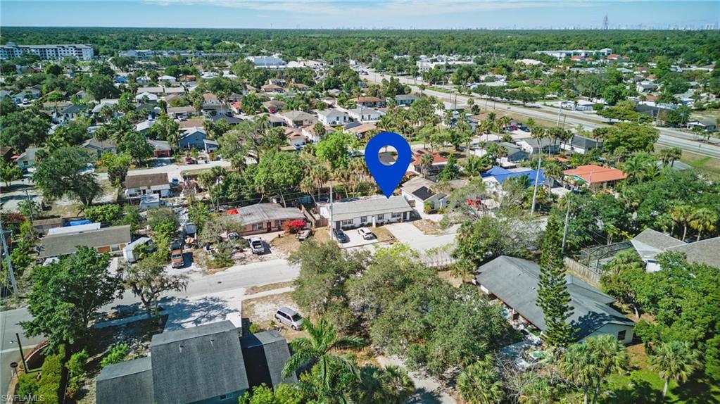 Aerial overview of property's location with nearby suburban area