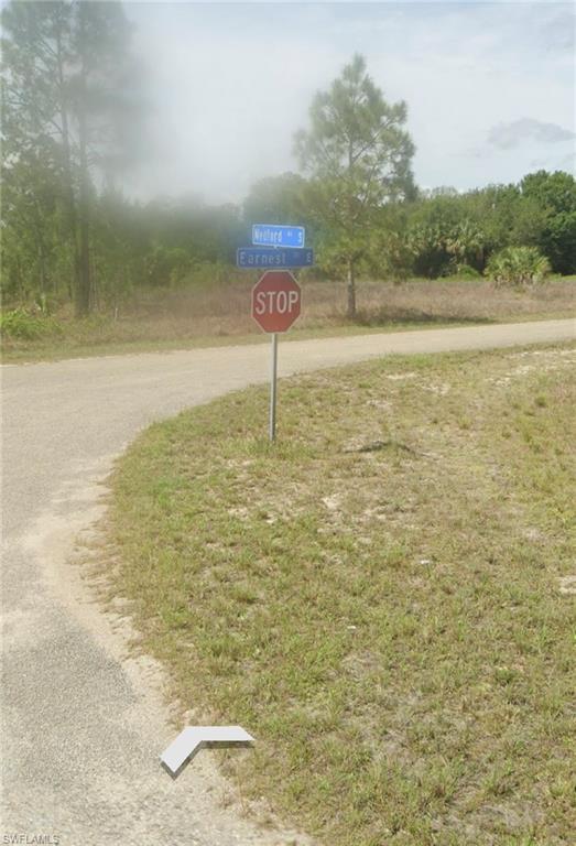 View of asphalt road featuring traffic signs