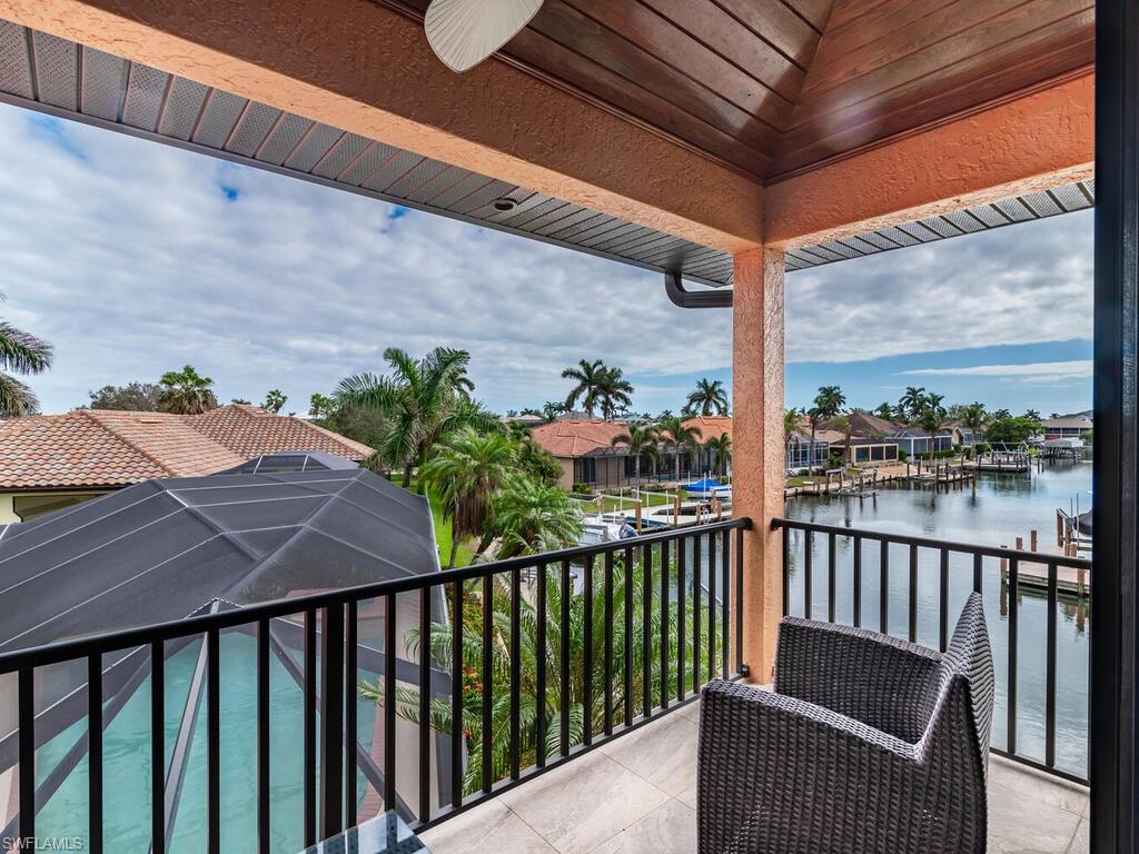 Balcony with ceiling fan and a water view