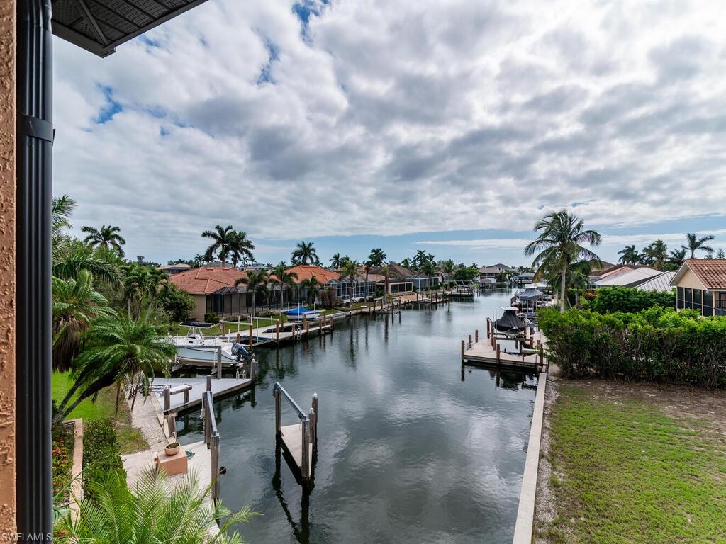 Property view of water featuring a dock