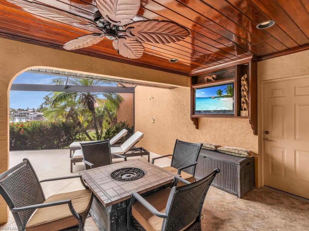 View of patio featuring ceiling fan