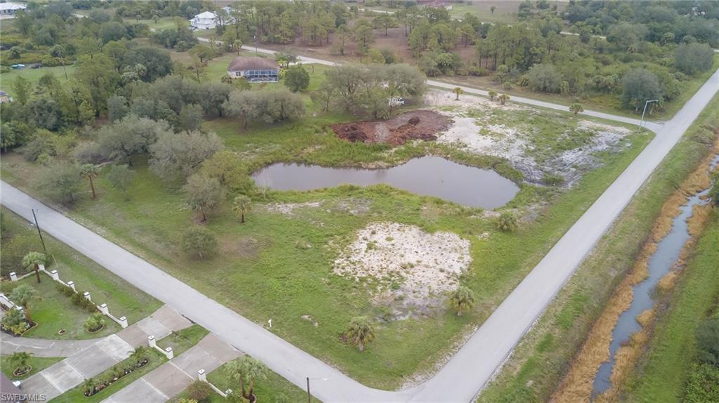 Aerial overview of property's location with a nearby body of water