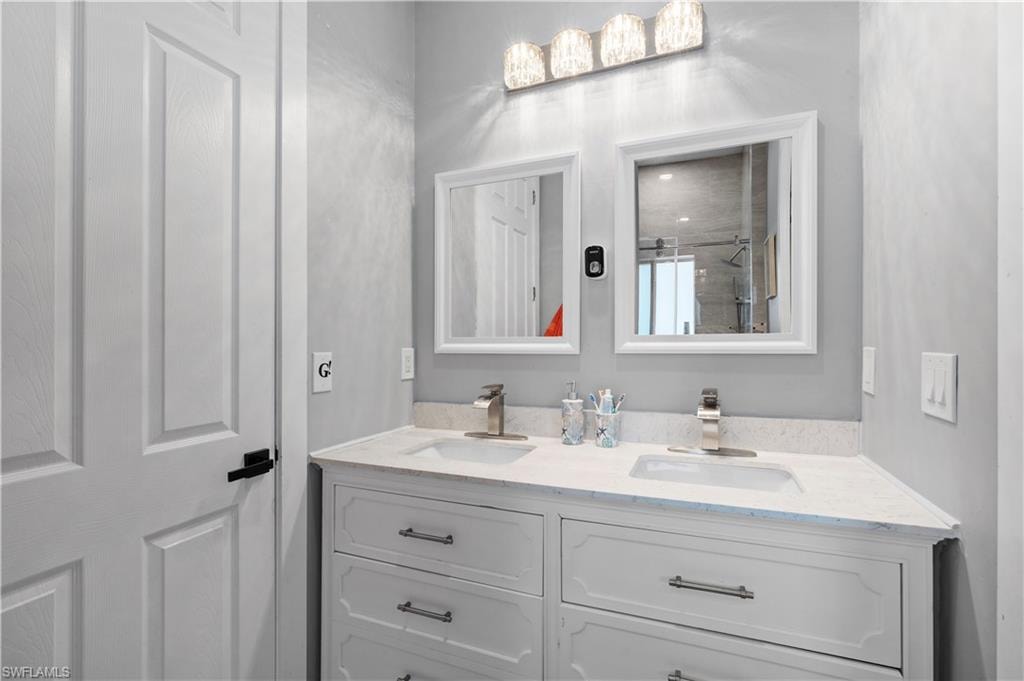 Bathroom featuring double vanity