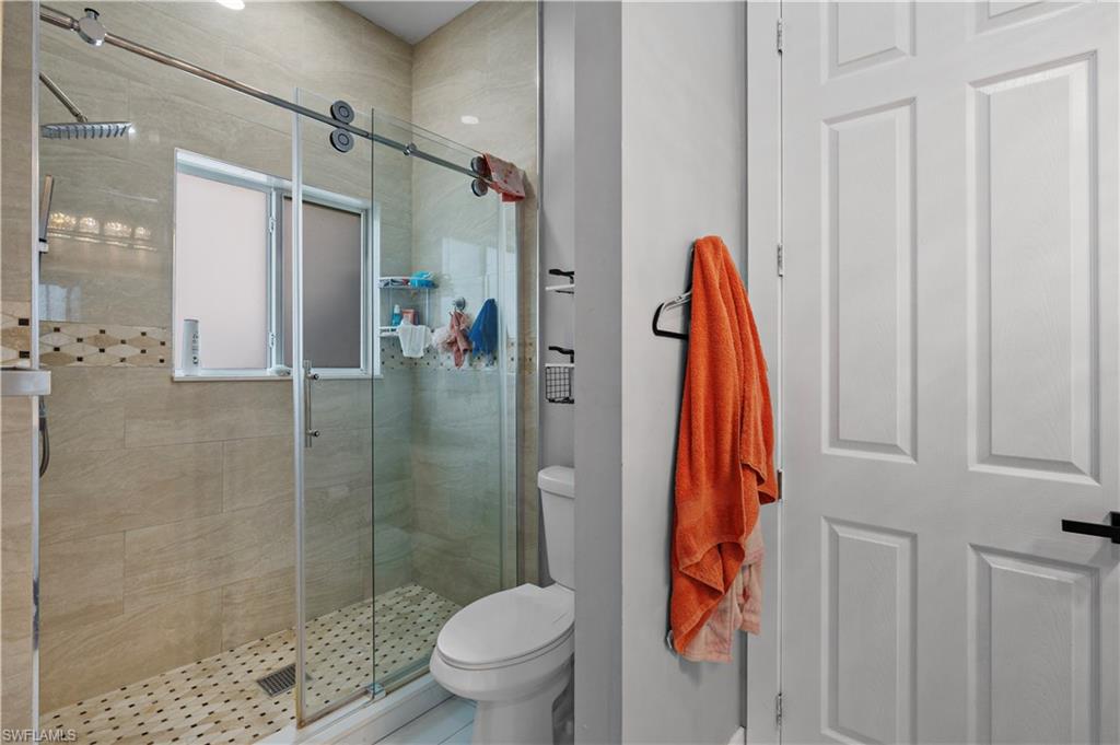 Bathroom with toilet and a shower stall