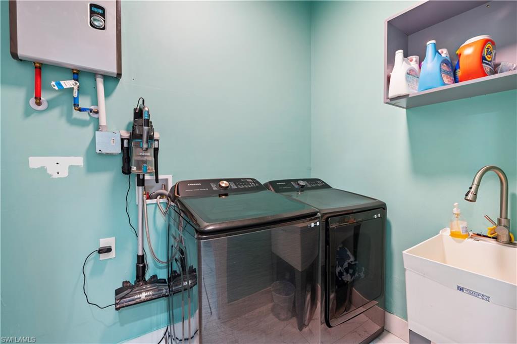 Laundry area with washing machine and clothes dryer