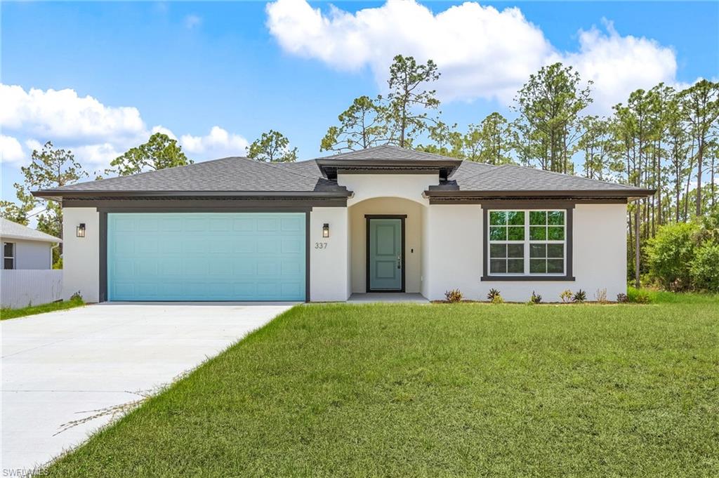 View of front of home featuring concrete driveway, stucco siding, a front yard, an attached garage, and a shingled roof