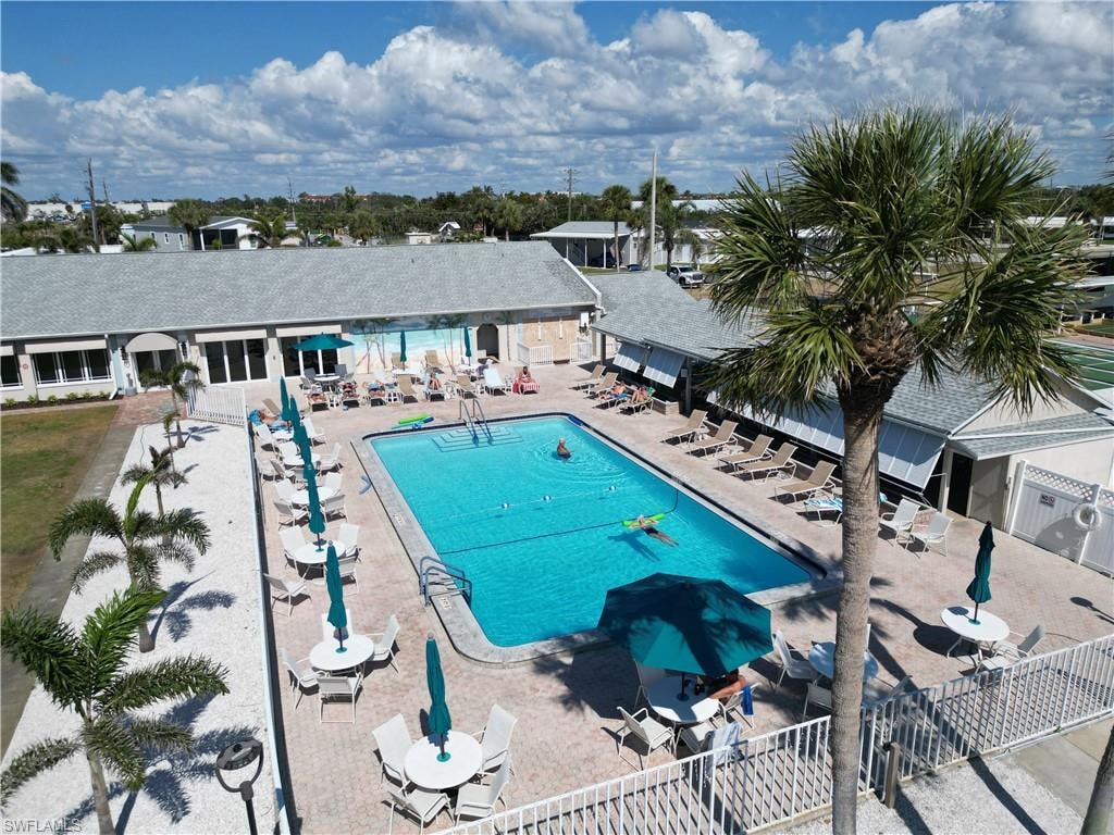 Community pool with a patio