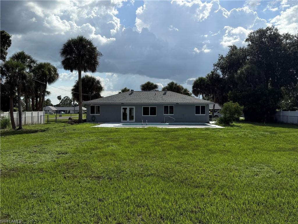 Rear view of property with a patio and stucco siding