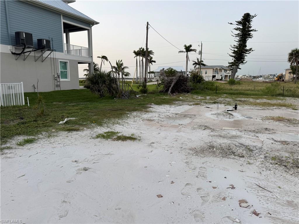 View of yard featuring a balcony