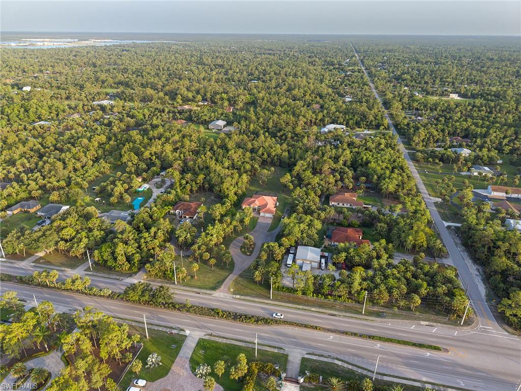 Aerial overview of property's location featuring a forest