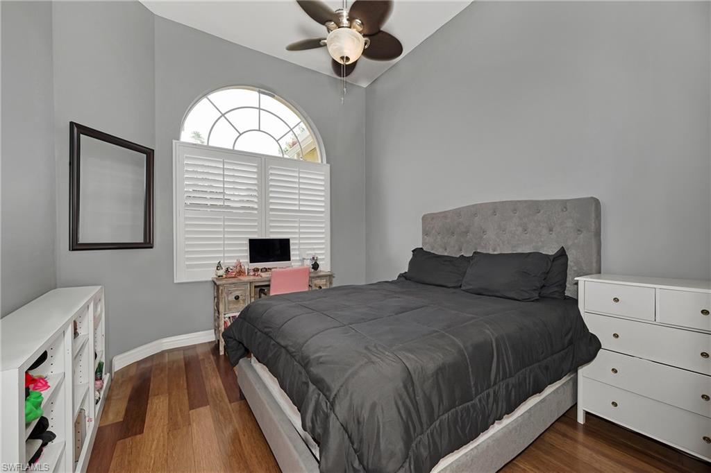 Bedroom with wood finished floors and ceiling fan