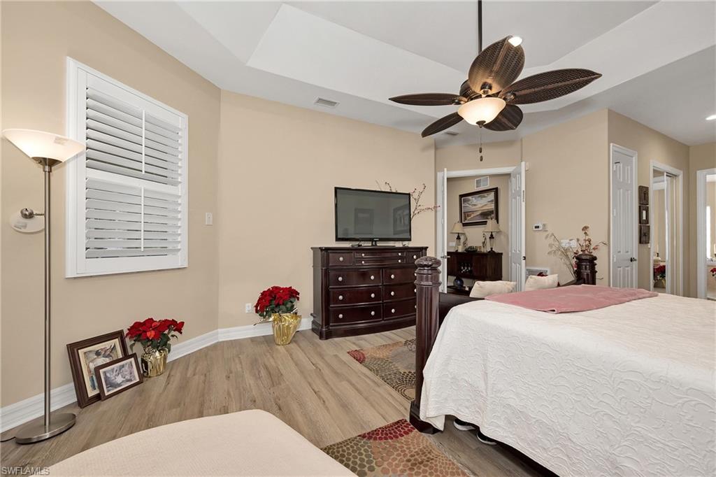 Bedroom with wood finished floors and ceiling fan