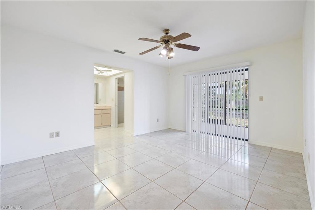 Bedroom featuring access to outside, light tile patterned floors, baseboards, and a ceiling fan