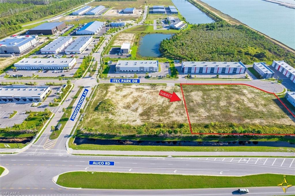 Aerial overview of property's location featuring property boundaries highlighted and a nearby body of water