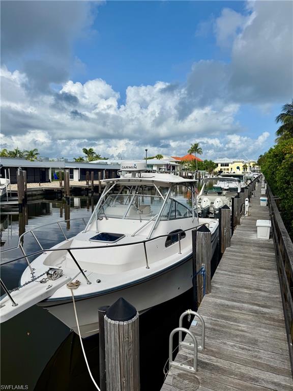 Dock area featuring boat slip C-10