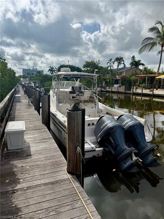 Dock area featuring boat slip C-10
