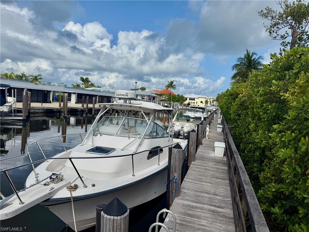 Dock area featuring boat slip C-10