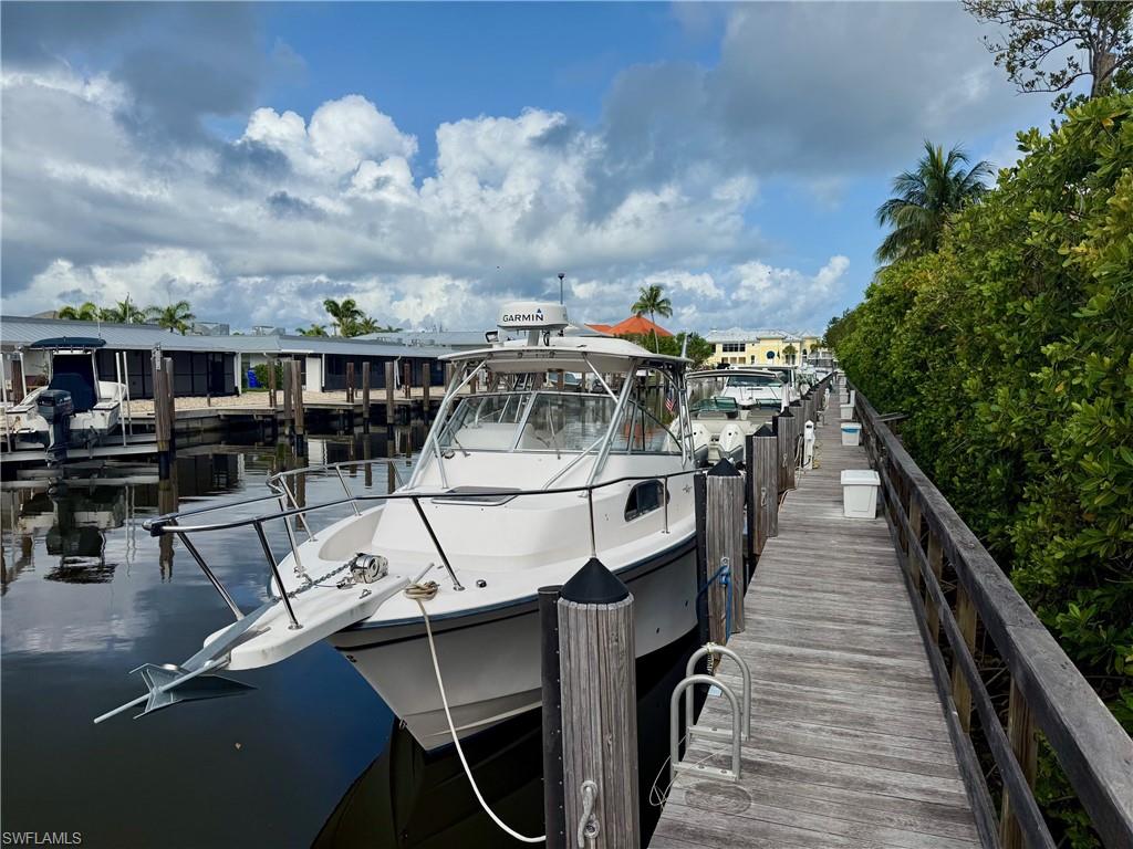 Dock area featuring boat slip C-10